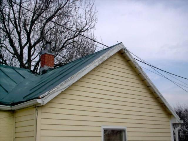 Power line touching on metal roof